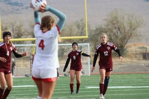 Special to Pahrump Valley Times The Trojans defense awaits a throw-in by a Truckee player duri ...