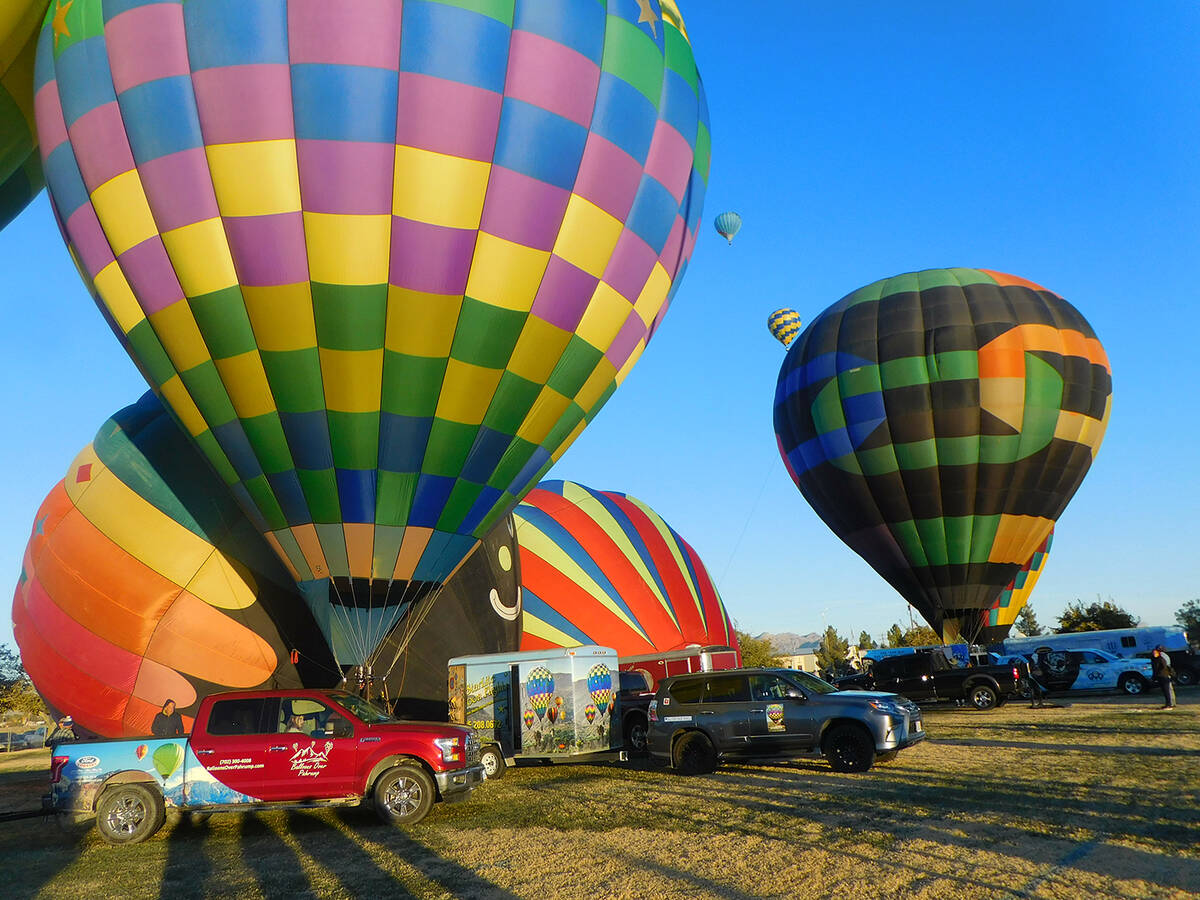 Robin Hebrock/Pahrump Valley Times Hot air balloons can be seen inflating in preparation for fl ...