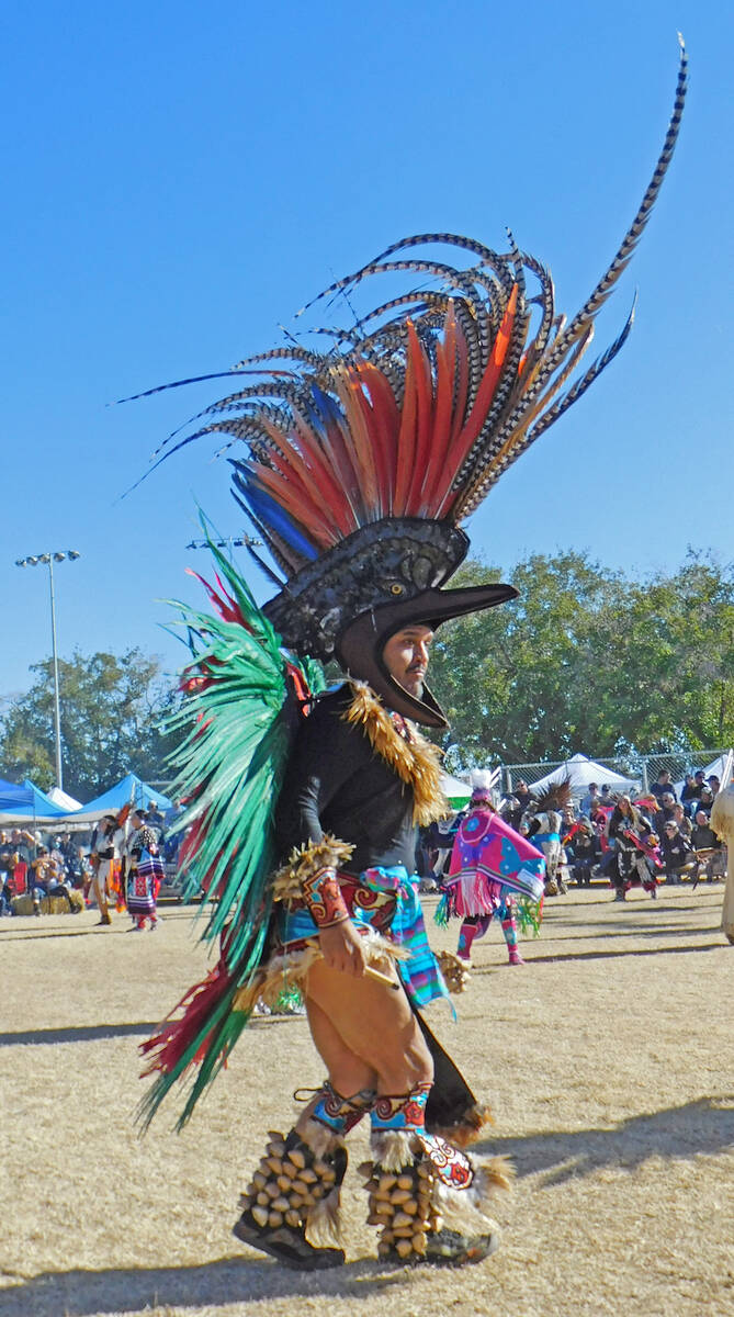 Robin Hebrock/Pahrump Valley Times An Aztec Dancer is pictured bathed in sunlight as he stomps ...