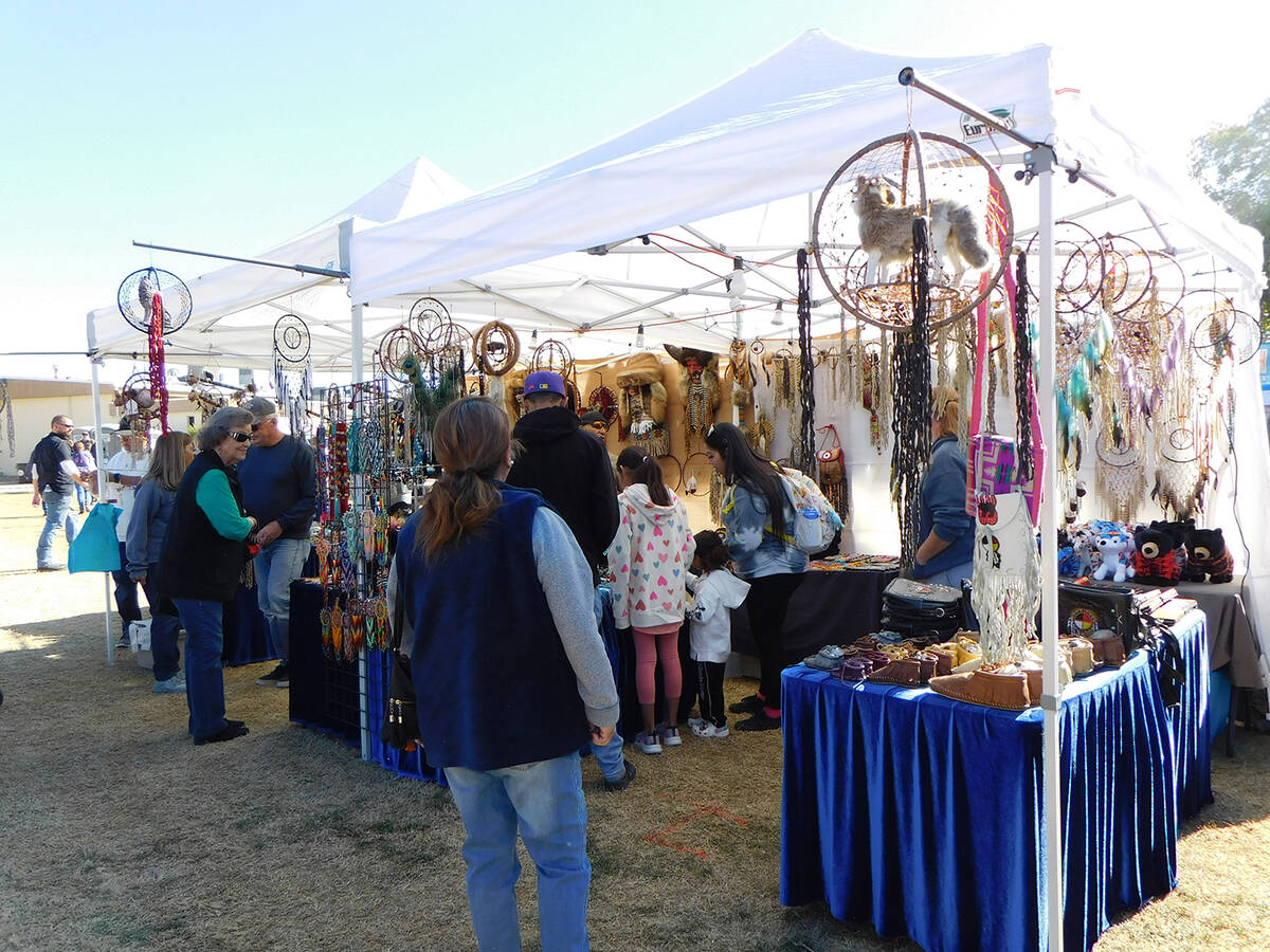 Robin Hebrock/Pahrump Valley Times Pahrump Powwow patrons are seen browsing a vendor booth feat ...