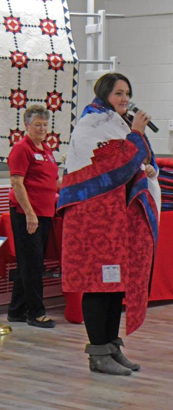 Robin Hebrock/Pahrump Valley Times Kelli McHam of the U.S. Army beams while wrapped snugly in h ...