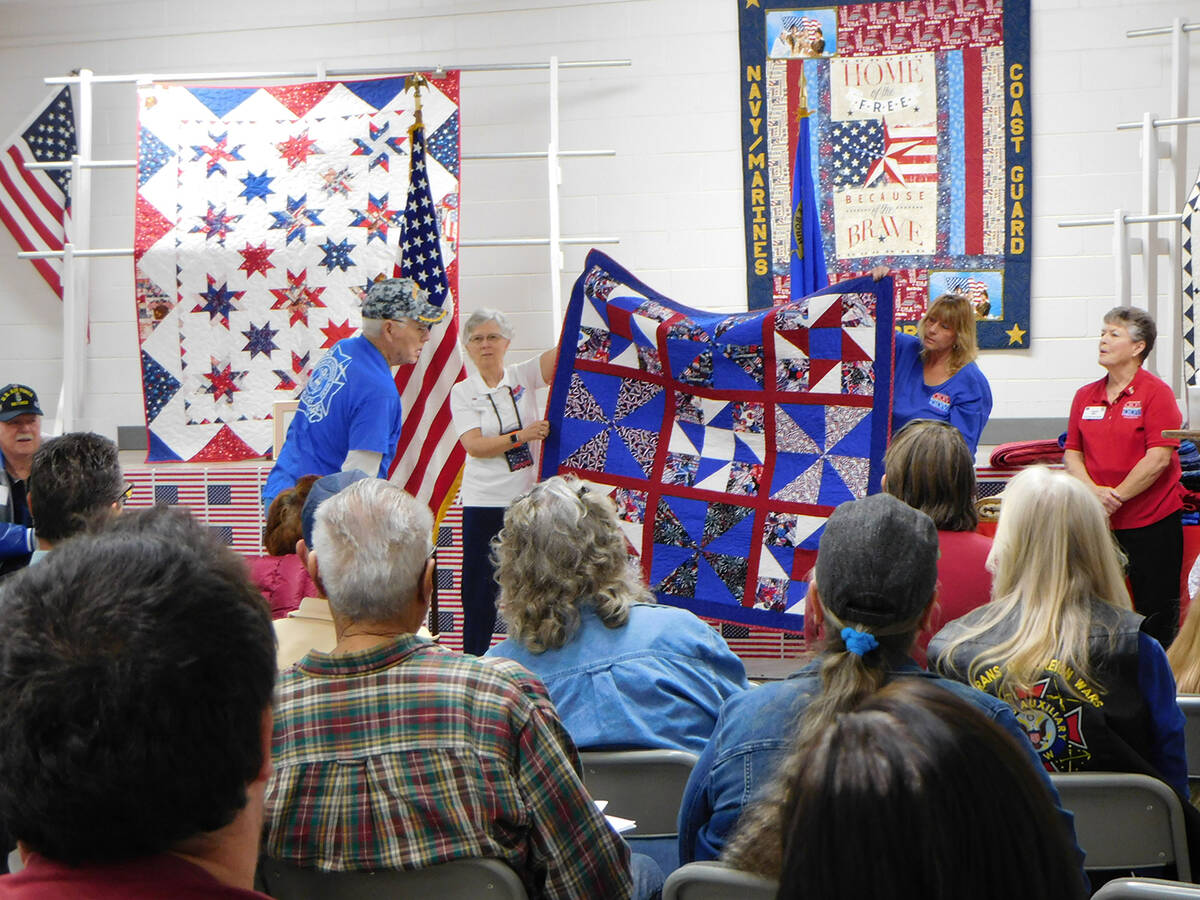 Robin Hebrock/Pahrump Valley Times Raymond Elgin, a U.S. Navy veteran, admires his new Quilt of ...
