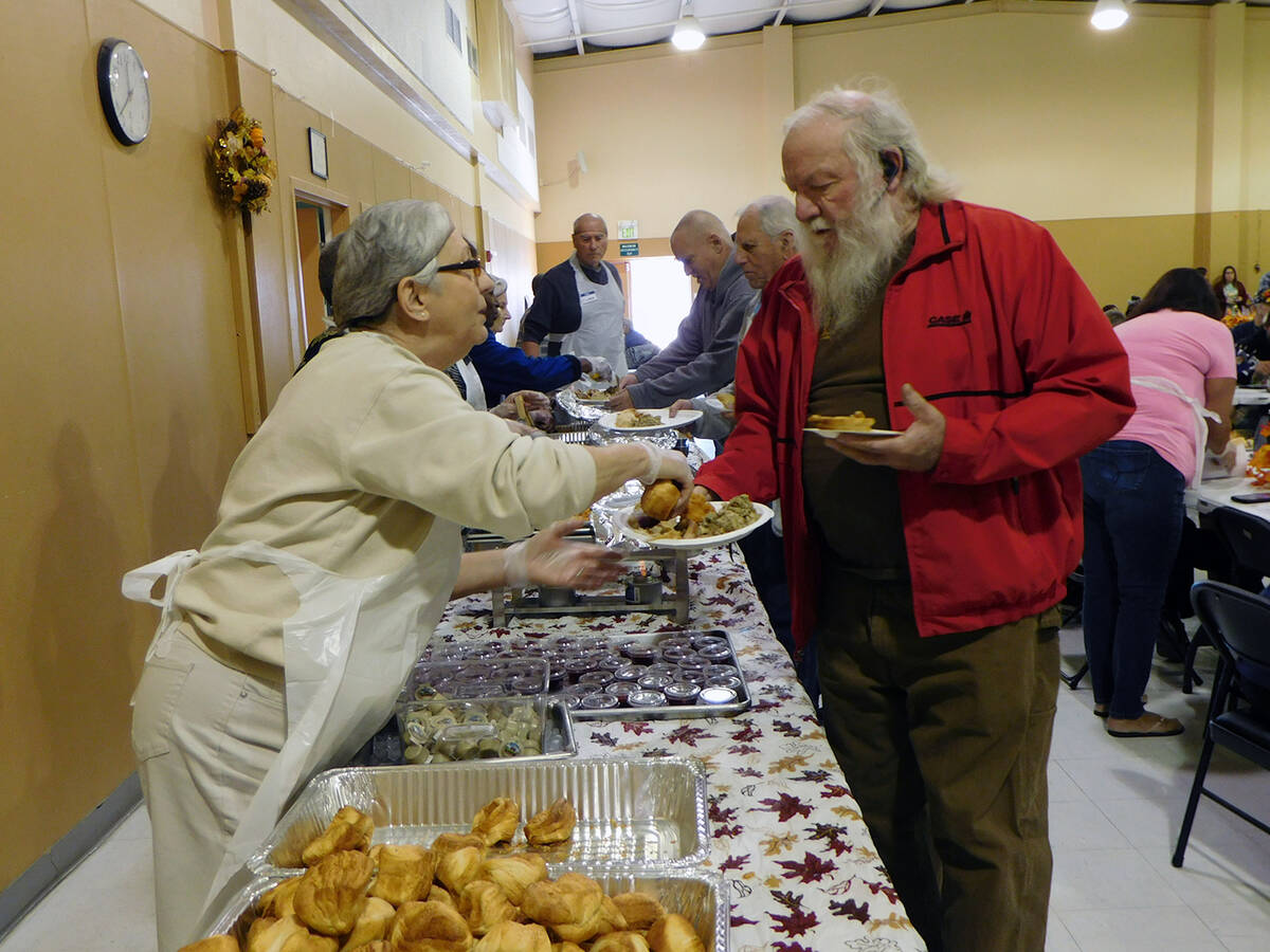 Robin Hebrock/Pahrump Valley Times A Community Thanksgiving Dinner attendee is pictured getting ...