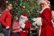 Deanna O'Donnell/Special to the Pahrump Valley Times Santa is seen speaking with a young girl a ...