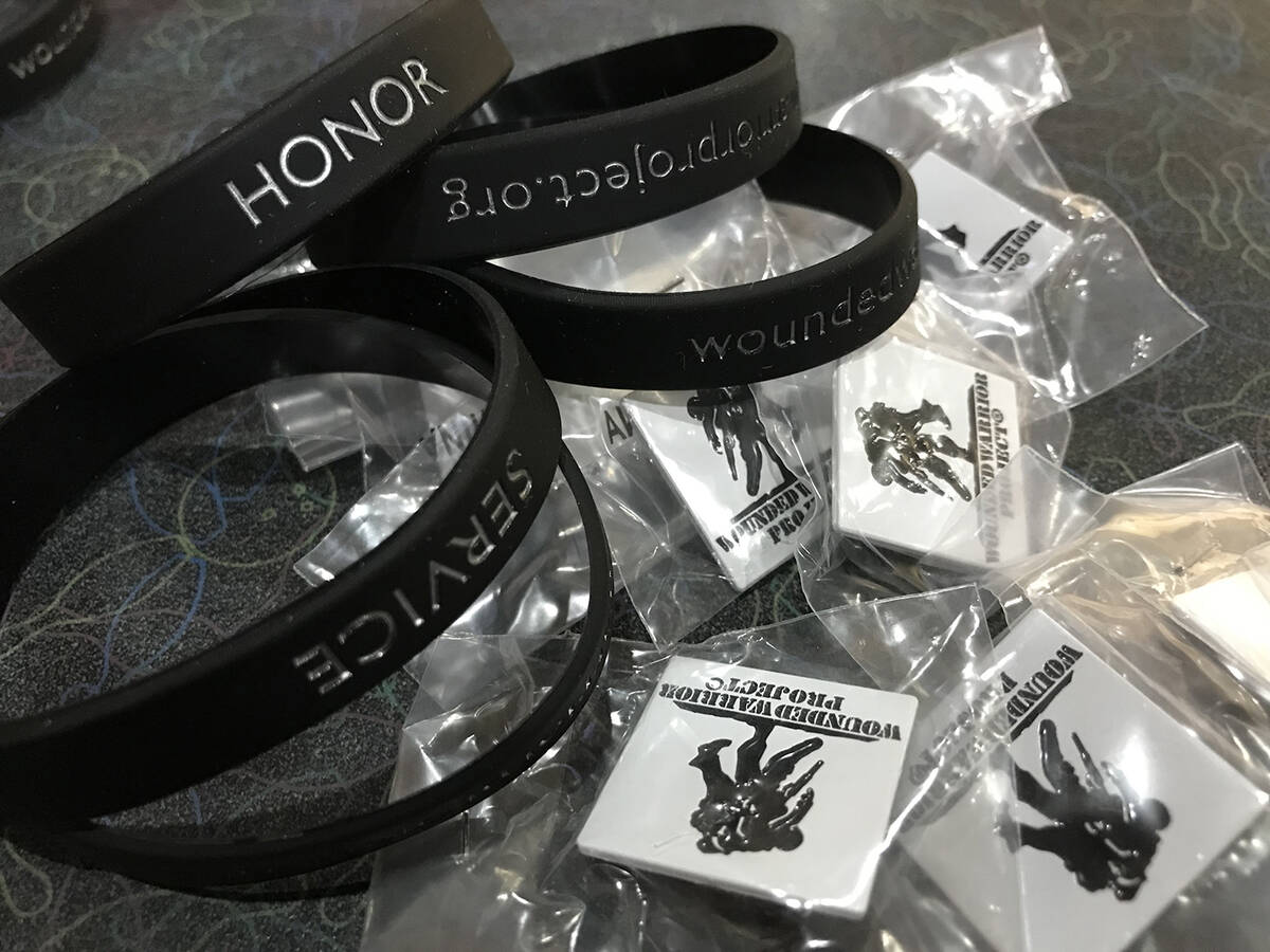 Robin Hebrock/Pahrump Valley Times Schwag such as Wounded Warrior bracelets and lapel pins were ...