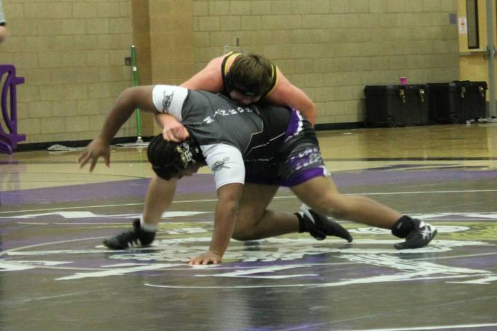 Danny Smyth/Pahrump Valley Times Senior Ty Hanks trying to flip his opponent over to get advant ...