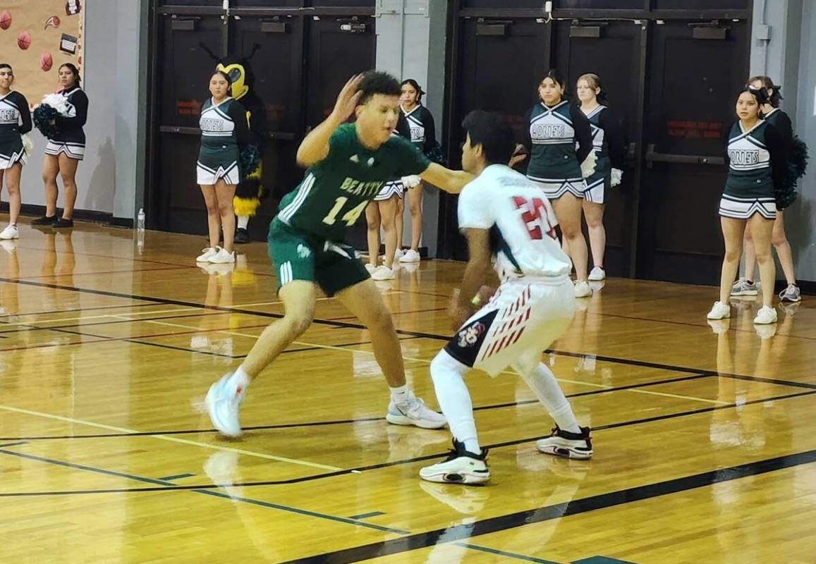 Danny Smyth/Pahrump Valley Times Sophomore forward Reese Taylor (14) defends against a Mountain ...