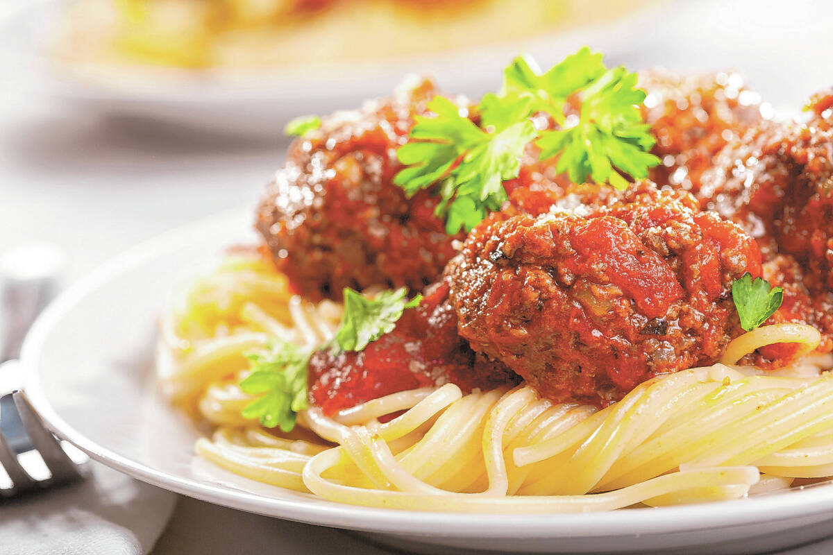 pasta with meatballs and parsley with tomato sauce