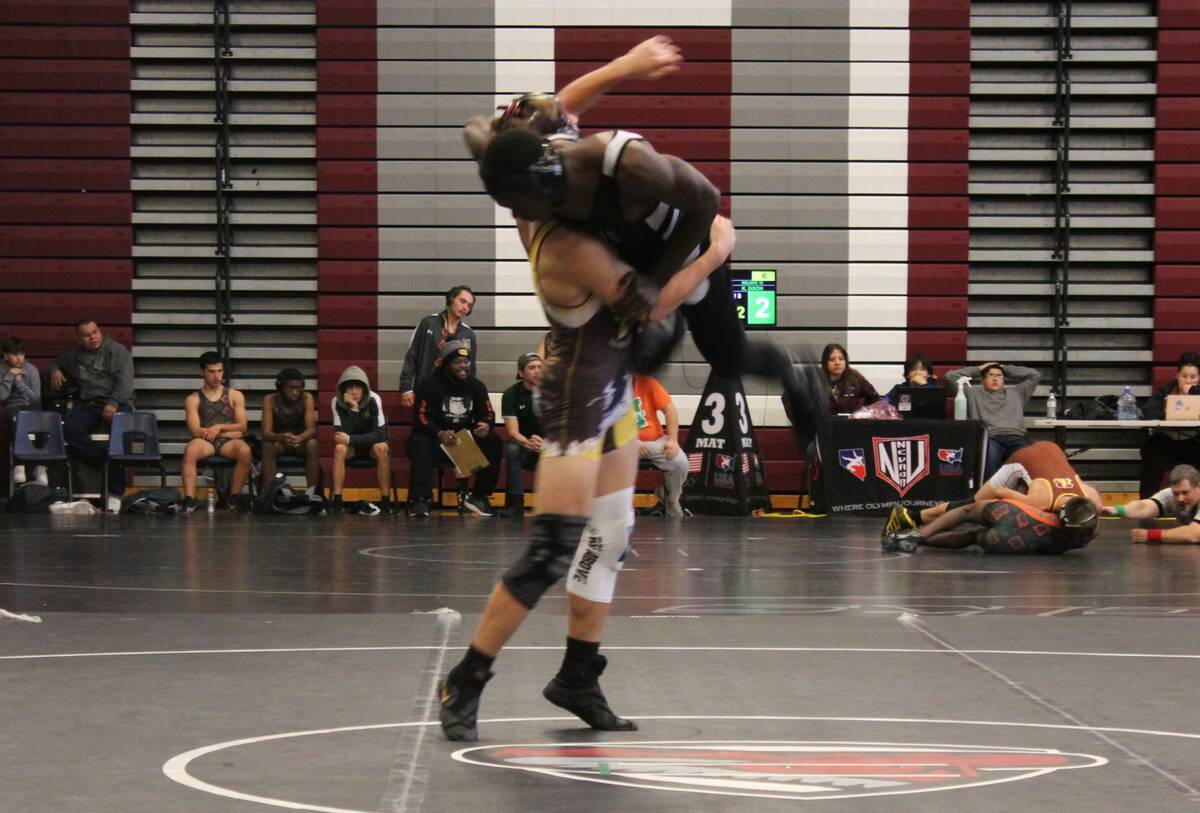 Danny Smyth/Pahrump Valley Times Ethan Hutchinson lifting his opponent off the ground before sl ...