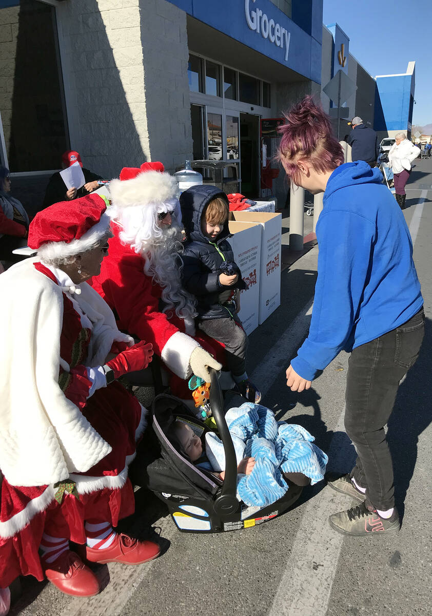 Robin Hebrock/Pahrump Valley Times Santa and Mrs. Claus were out at the Toys for Tots collectio ...