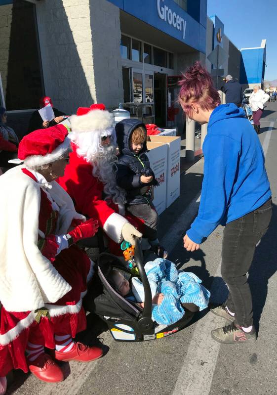 Robin Hebrock/Pahrump Valley Times Santa and Mrs. Claus were out at the Toys for Tots collectio ...