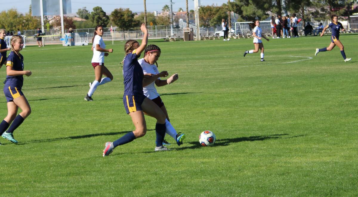 Danny Smyth/Pahrump Valley Times Junior defender Paris Coleman (8) fighting off a Boulder City ...