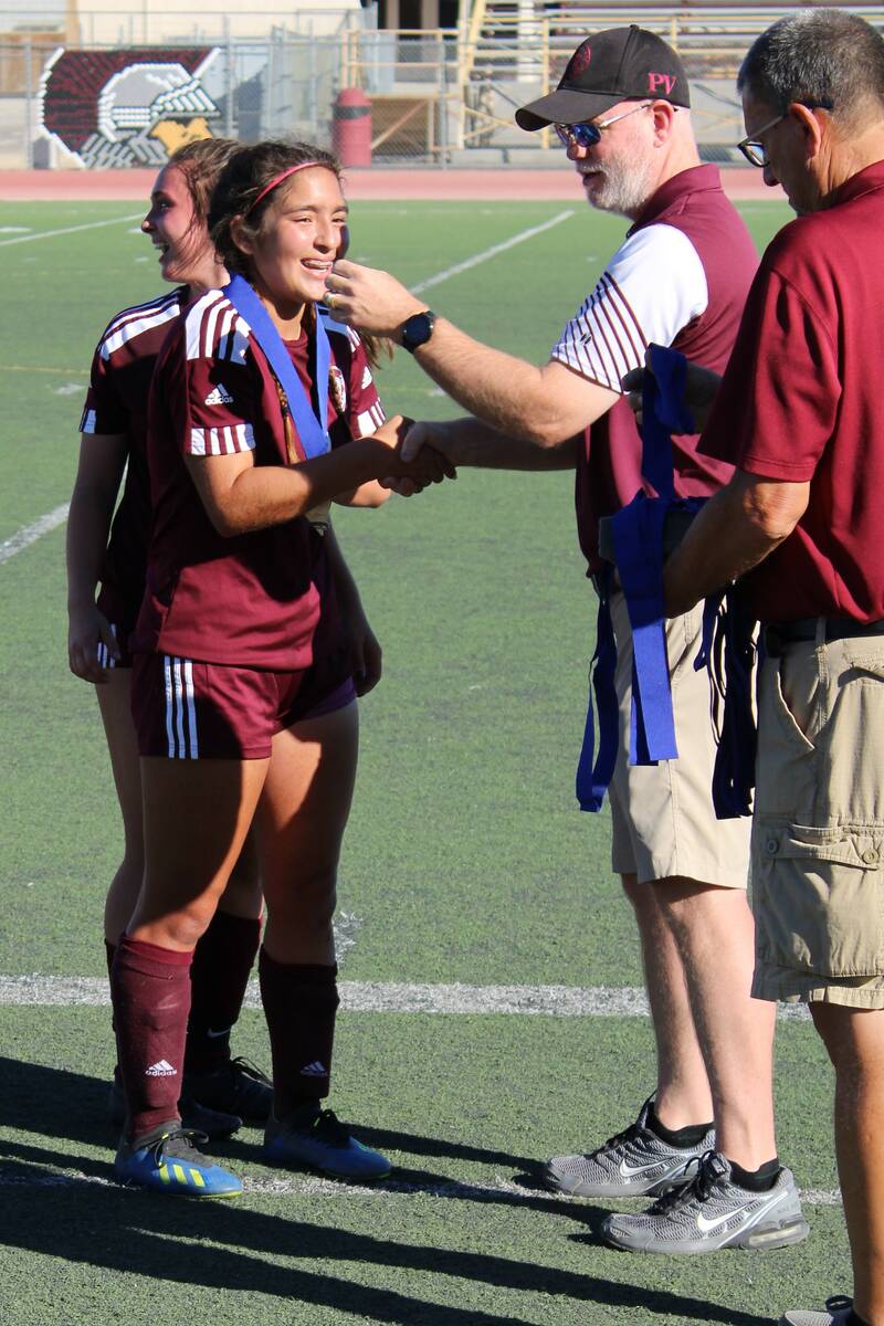 Danny Smyth/Pahrump Valley Times Paris Coleman (8) receiving her state championship medal from ...