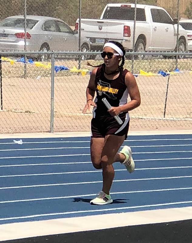 Tom Rysinski/Pahrump Valley Times Sophomore Paris Coleman runs the second leg of the 4 x 800 re ...