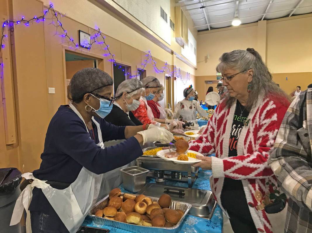 Robin Hebrock/Pahrump Valley Times Volunteers are pictured manning the buffet at the Pahrump Ho ...