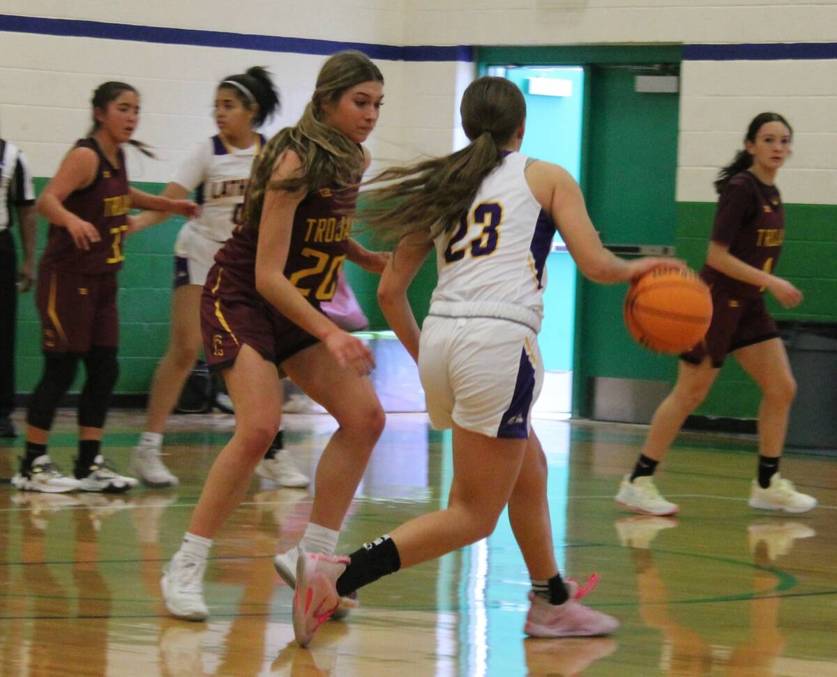 Danny Smyth/Pahrump Valley Times Lady Trojans' guard Avery Moore (20) defending against a Lathr ...