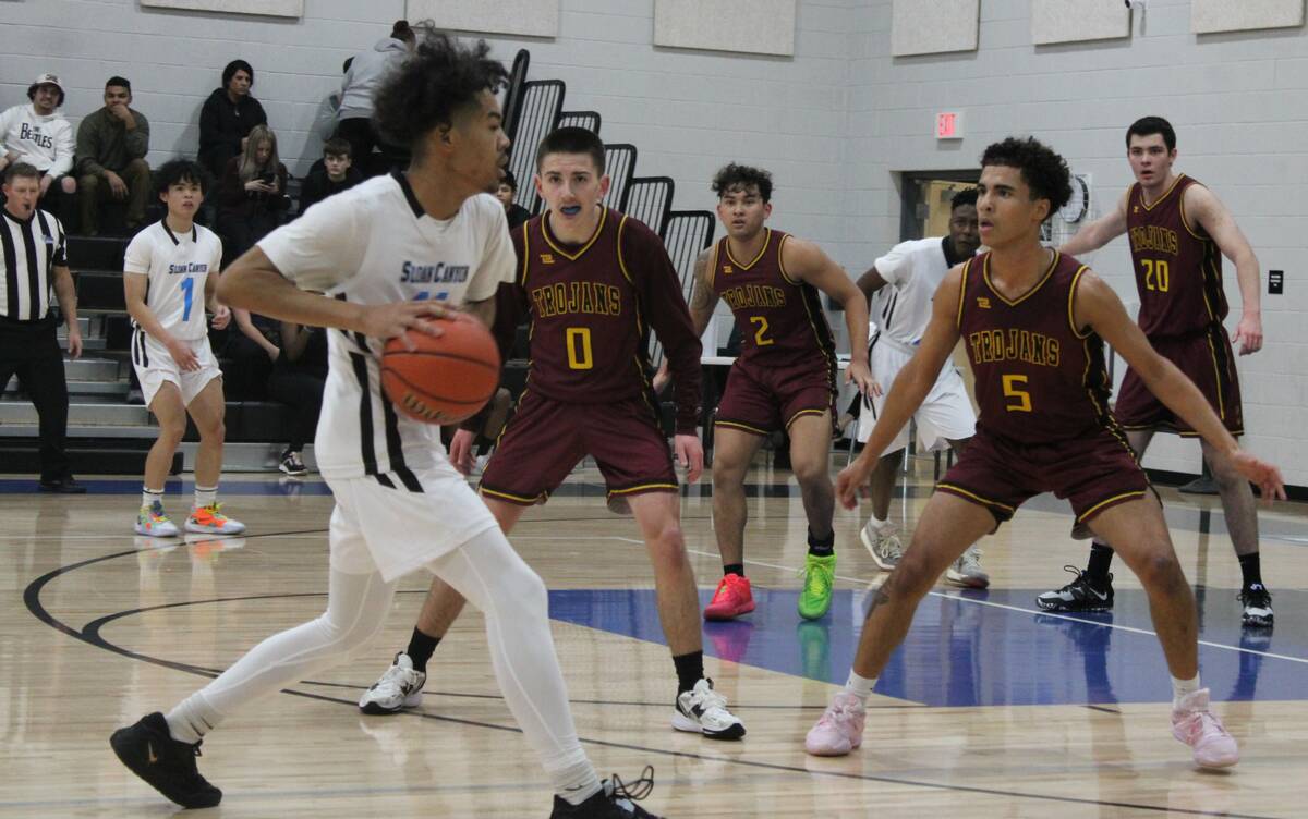 Danny Smyth/Pahrump Valley Times Guards Daxton Whittle (5) and Dylan Avena (0) on defense ready ...