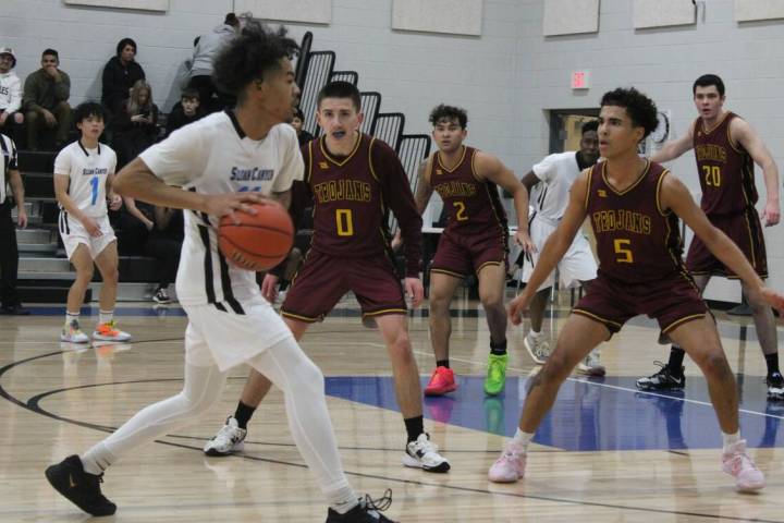 Danny Smyth/Pahrump Valley Times Guards Daxton Whittle (5) and Dylan Avena (0) on defense ready ...