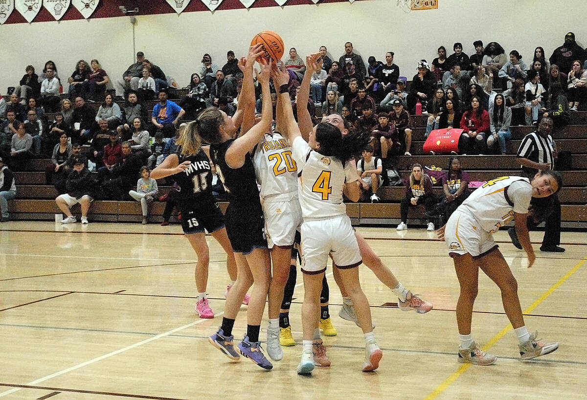 Horace Langford Jr./Pahrump Valley Times Pahrump junior guard Avery Moore going up to grab one ...