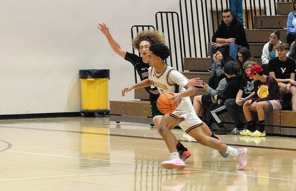 Horace Langford Jr./Pahrump Valley Times Pahrump Valley guard Daxton Whittle (5) dribbling past ...