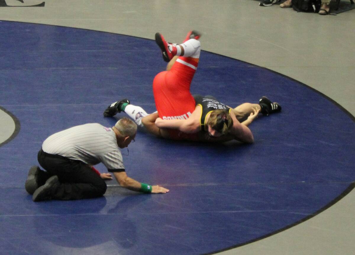 Danny Smyth/Pahrump Valley Times Ethan Hutchinson (right) putting in a pin against his opponent ...