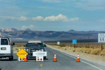 A roadblock remains on State Route 190 leading into Death Valley National Park following monsoo ...