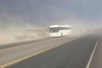 Pahrump Valley Times file photo Dust fills the air in the Pahrump Valley on a windy day in Dece ...