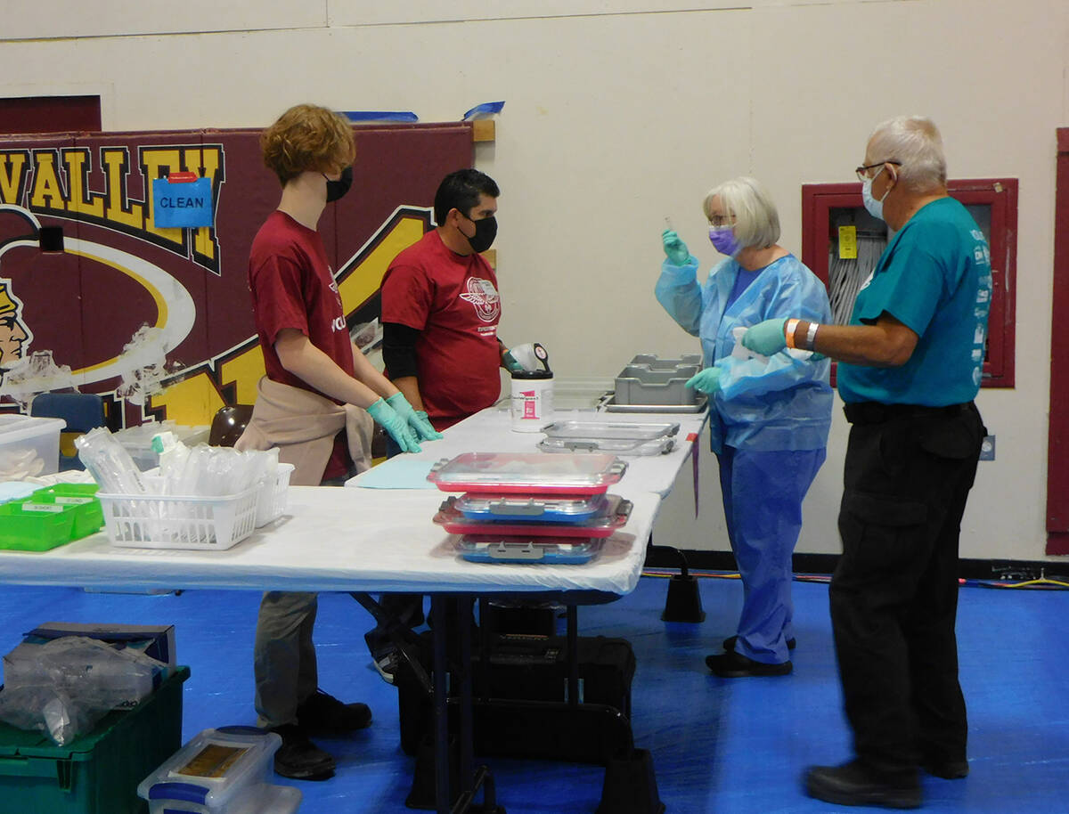 Robin Hebrock/Pahrump Valley Times Remote Area Medical volunteers are pictured discussing the d ...