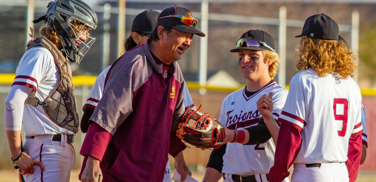 John Clausen/Pahrump Valley Times Head coach Roy Uyeno talking with his players on the pitcher' ...