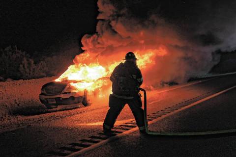 Special to the Pahrump Valley Times Fire crews battle a structure fire on Manse Road on Oct. 29 ...