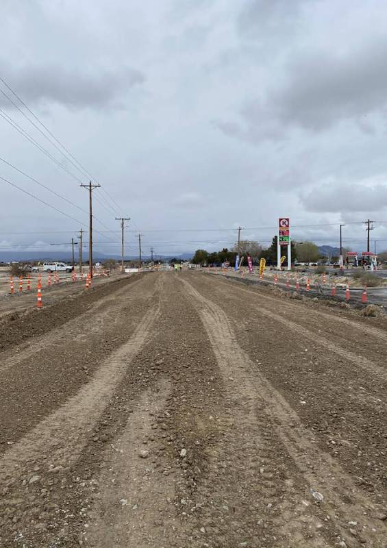 Photo Courtesy of Nye County Public Works The photo shows the view of Basin Avenue looking west ...