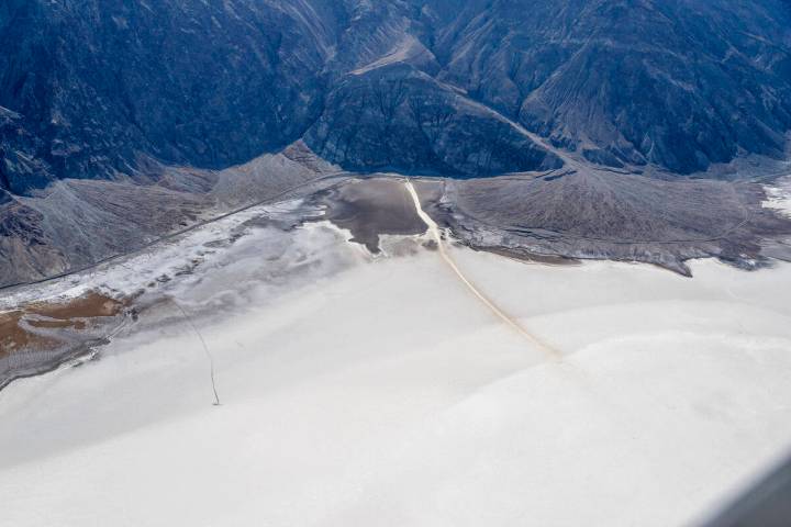 Death Valley National Park A Texas woman hiking in Badwater Basin, a remote area of Death Valle ...