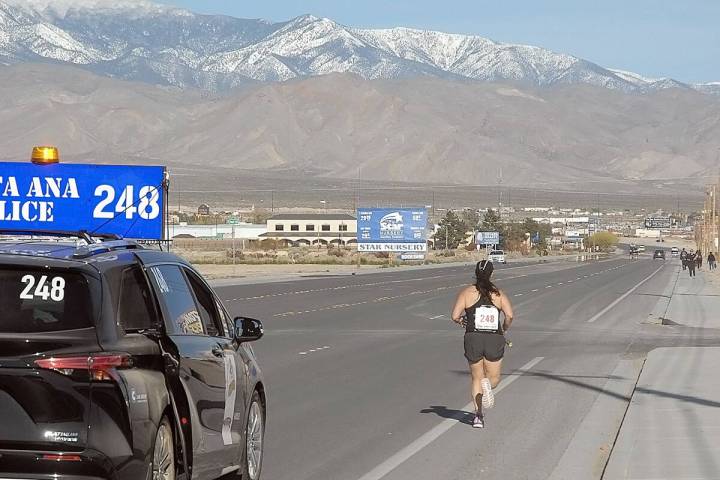 Horace Langford Jr/Pahrump Valley Times A member of the Santa Ana Police Department running thr ...