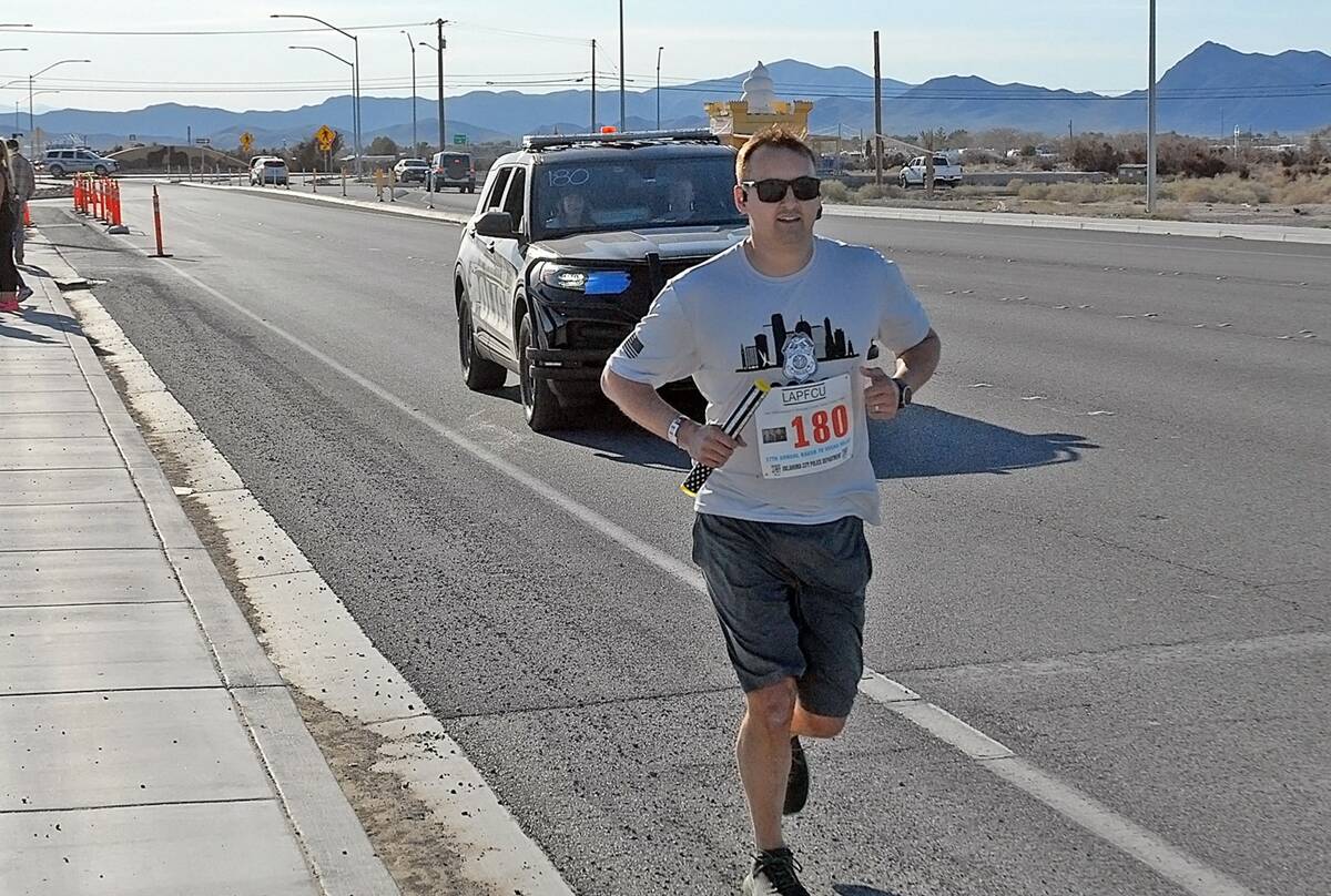 Horace Langford Jr/Pahrump Valley Times A member of the Oklahoma City Police Department running ...