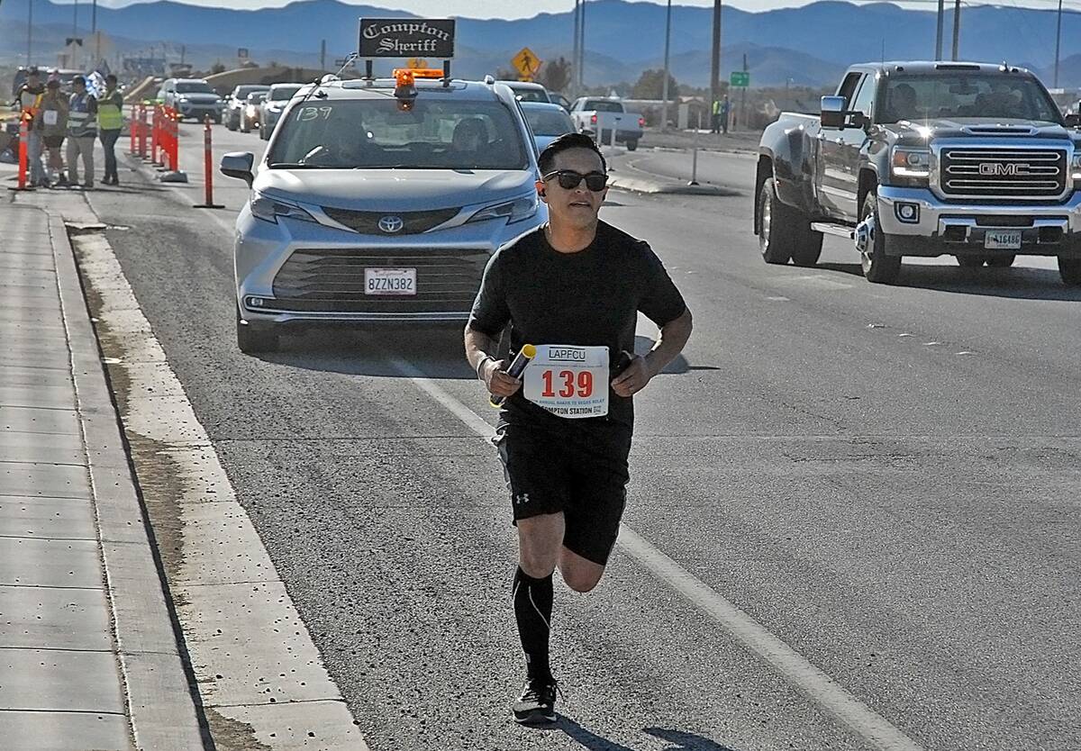 Horace Langford Jr/Pahrump Valley Times A member of the Compton Station team running through Pa ...