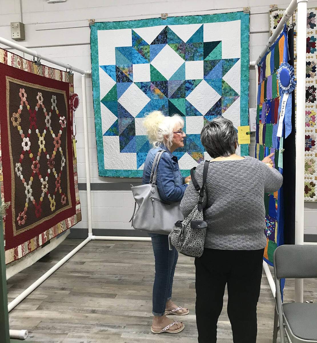 Robin Hebrock/Pahrump Valley Times Pins and Needles Quilt Show attendees are seen admiring the ...