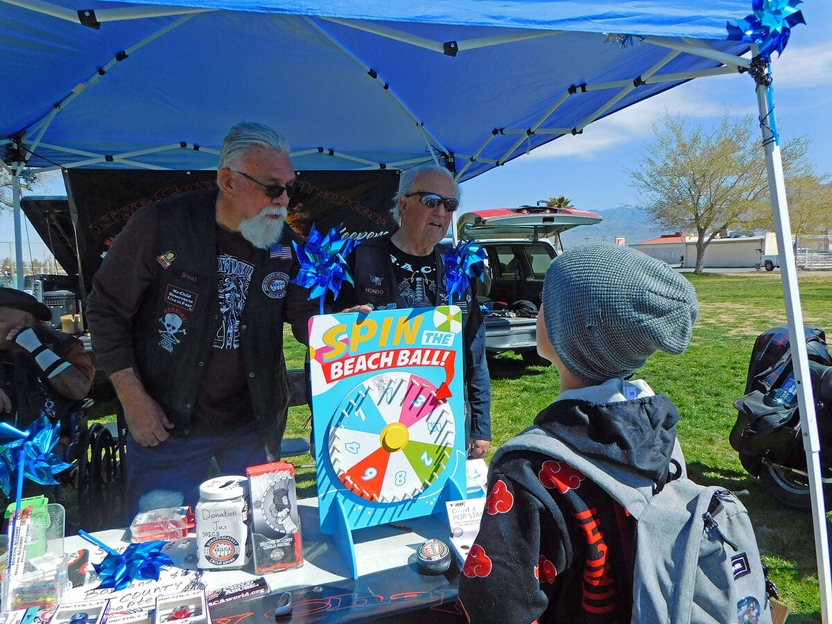 Robin Hebrock/Pahrump Valley Times The Bikers Against Child Abuse booth hand a "Spin to Win" fe ...