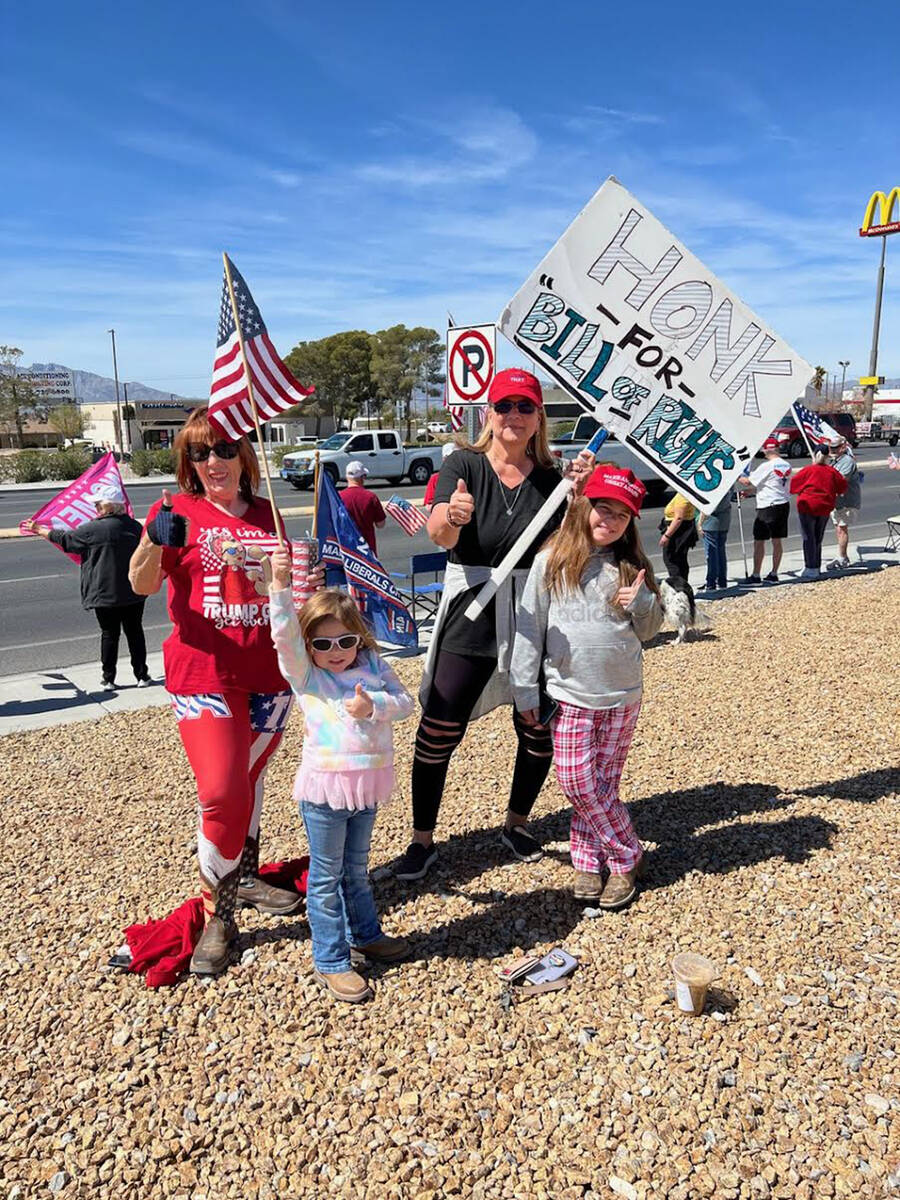 Special to the Pahrump Valley Times Wearing patriotic colors, waving homemade signs and carryin ...