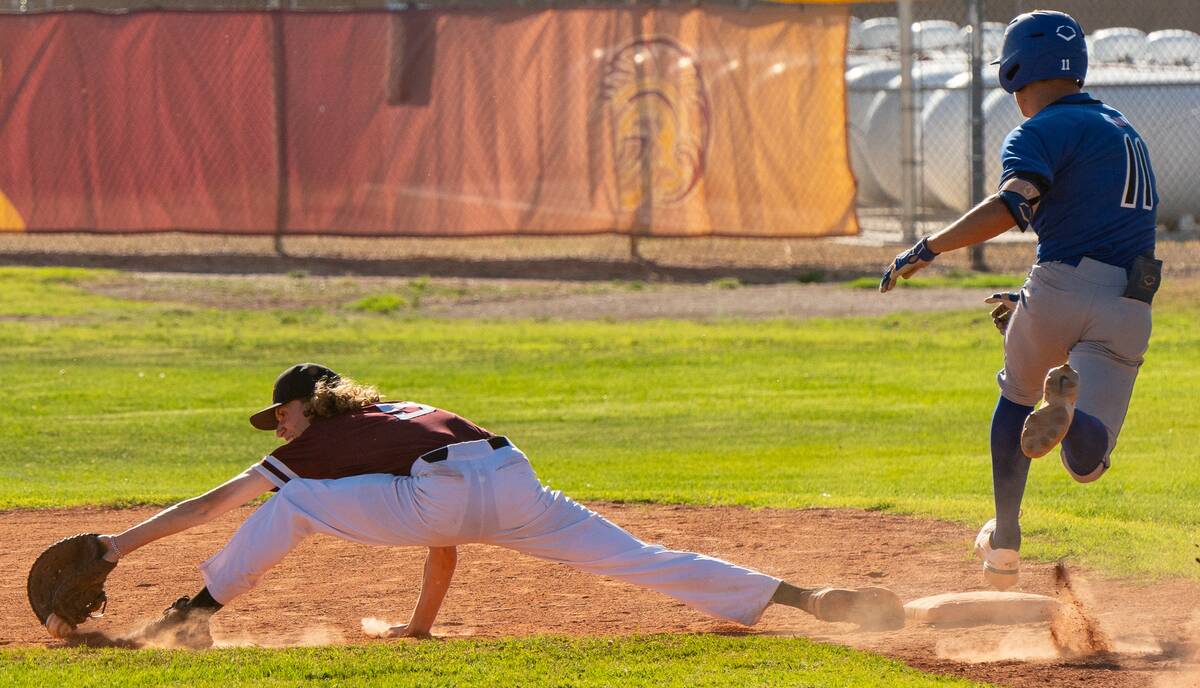 John Clausen/Pahrump Valley Times Matt Array (9) stretching out for the ball to secure an out i ...
