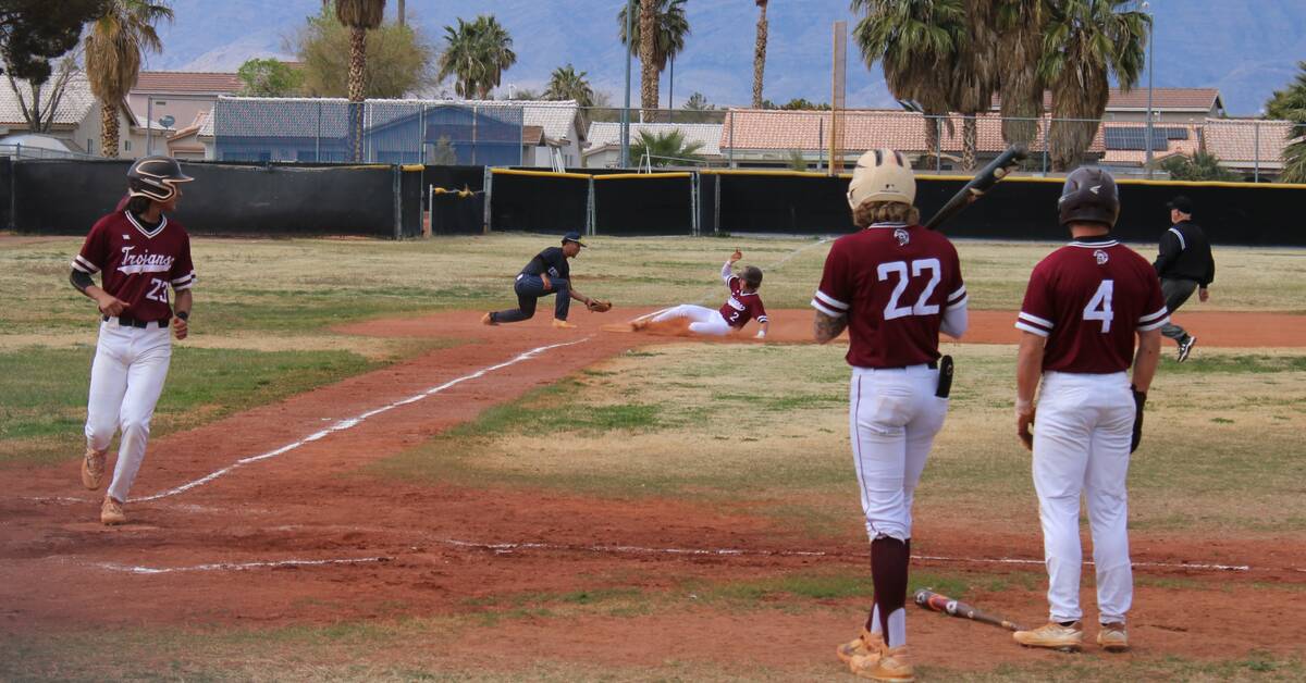 Danny Smyth/Pahrump Valley Times Senior Kyle McDaniel (2) slides into third base as senior Fide ...