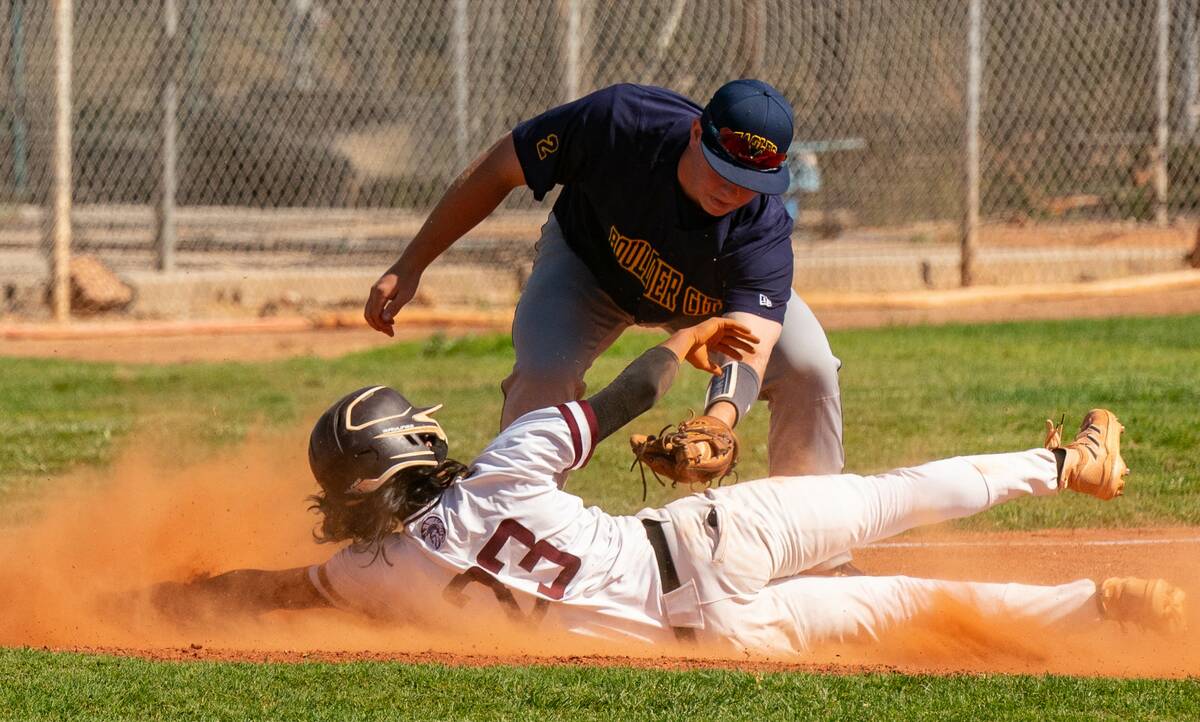 John Clausen/Pahrump Valley Times Senior Fidel Betancourt (23) attempts to avoid a tag while di ...
