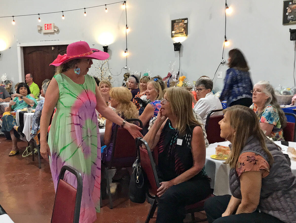 Robin Hebrock/Pahrump Valley Times Durette Candito, dressed in a summery tie-dye dress and pink ...