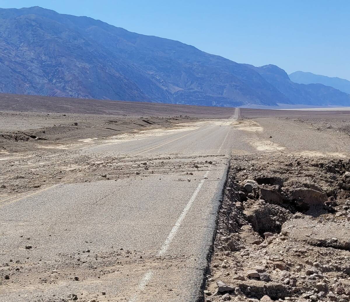 National Park Service Death Valley National Park employees moved dirt and rocks off the road an ...