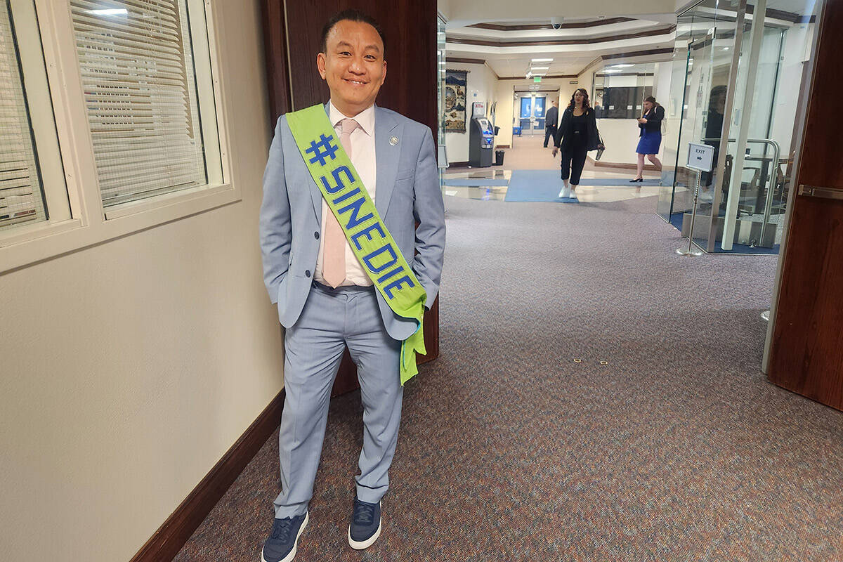 Assemblyman Duy Nguyen, D-Las Vegas, poses for a photo while wearing a sash commemorating sine ...