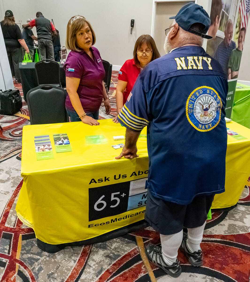 John Clausen/Pahrump Valley Times A Navy veteran chats with a vendor taking part in the Pahrump ...