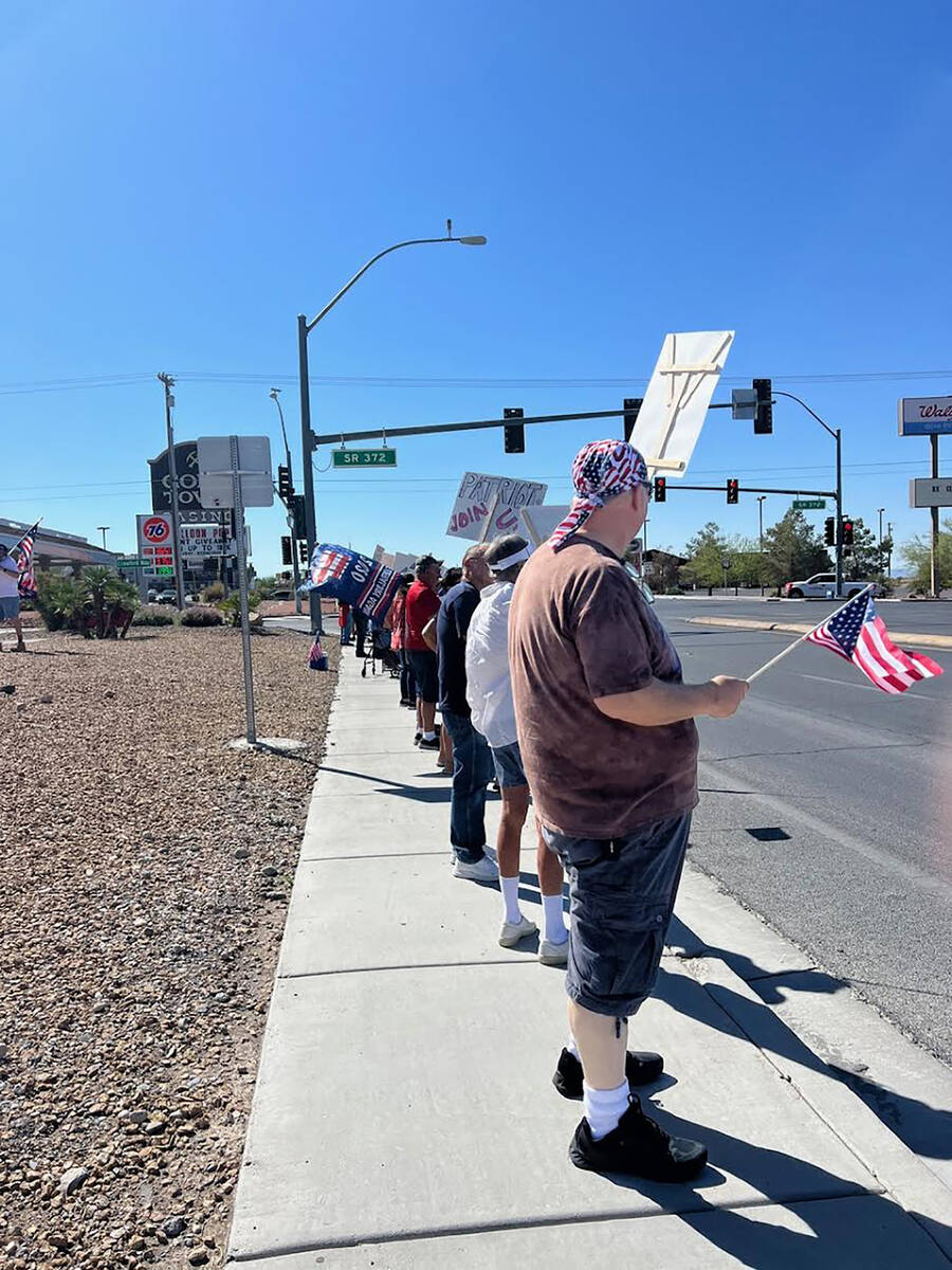 Special to the Pahrump Valley Times Rally-goers also carried flags and waved at passersby.