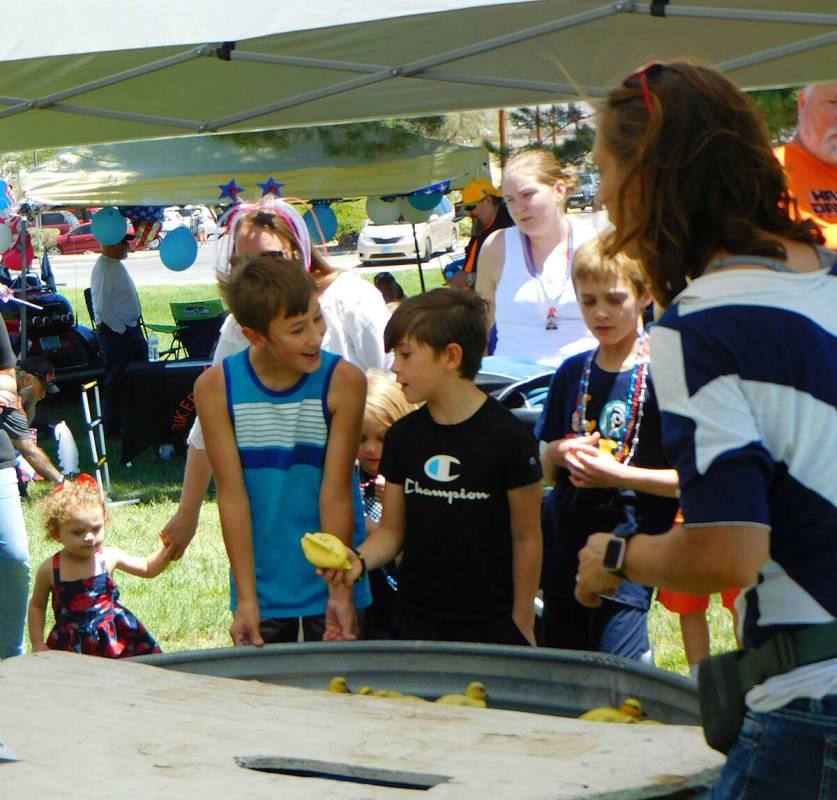 Robin Hebrock/Pahrump Valley Times Two young boys are pictured playing the "pick-a-chick" game ...