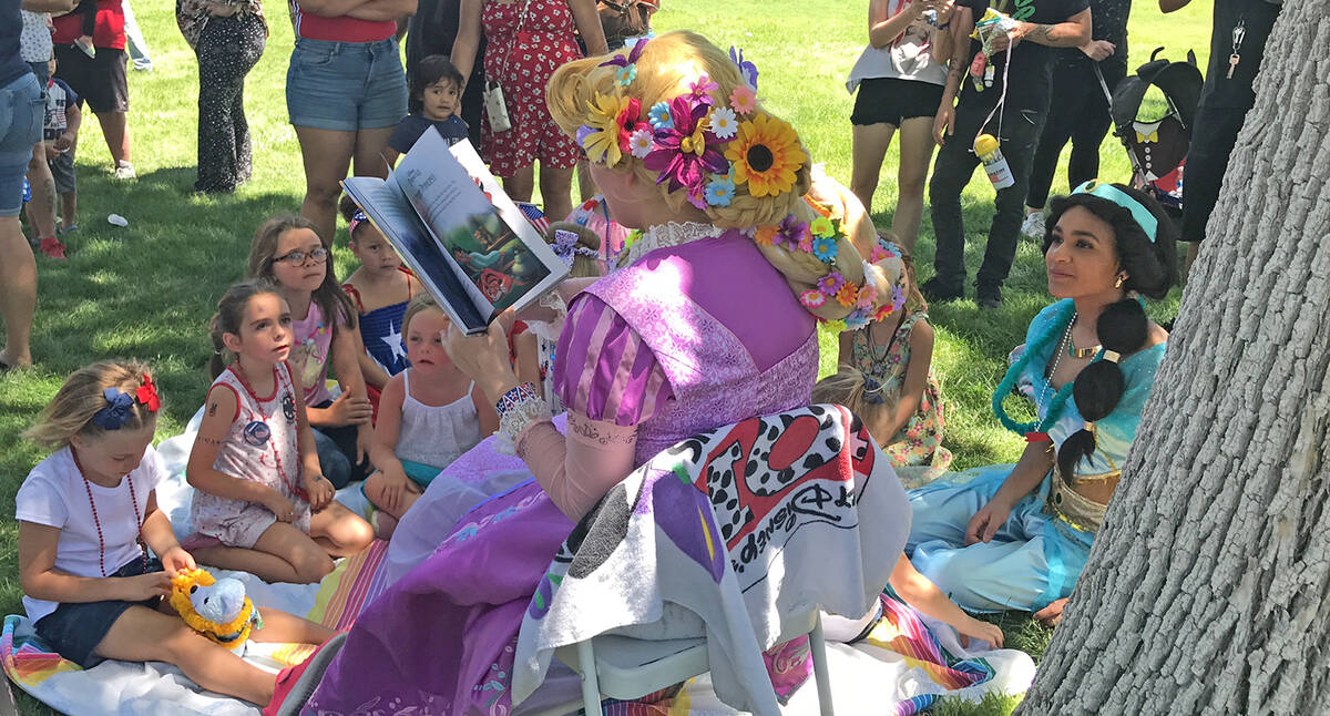 Robin Hebrock/Pahrump Valley Times Princesses from Wish Upon a Princess Party read stories to F ...