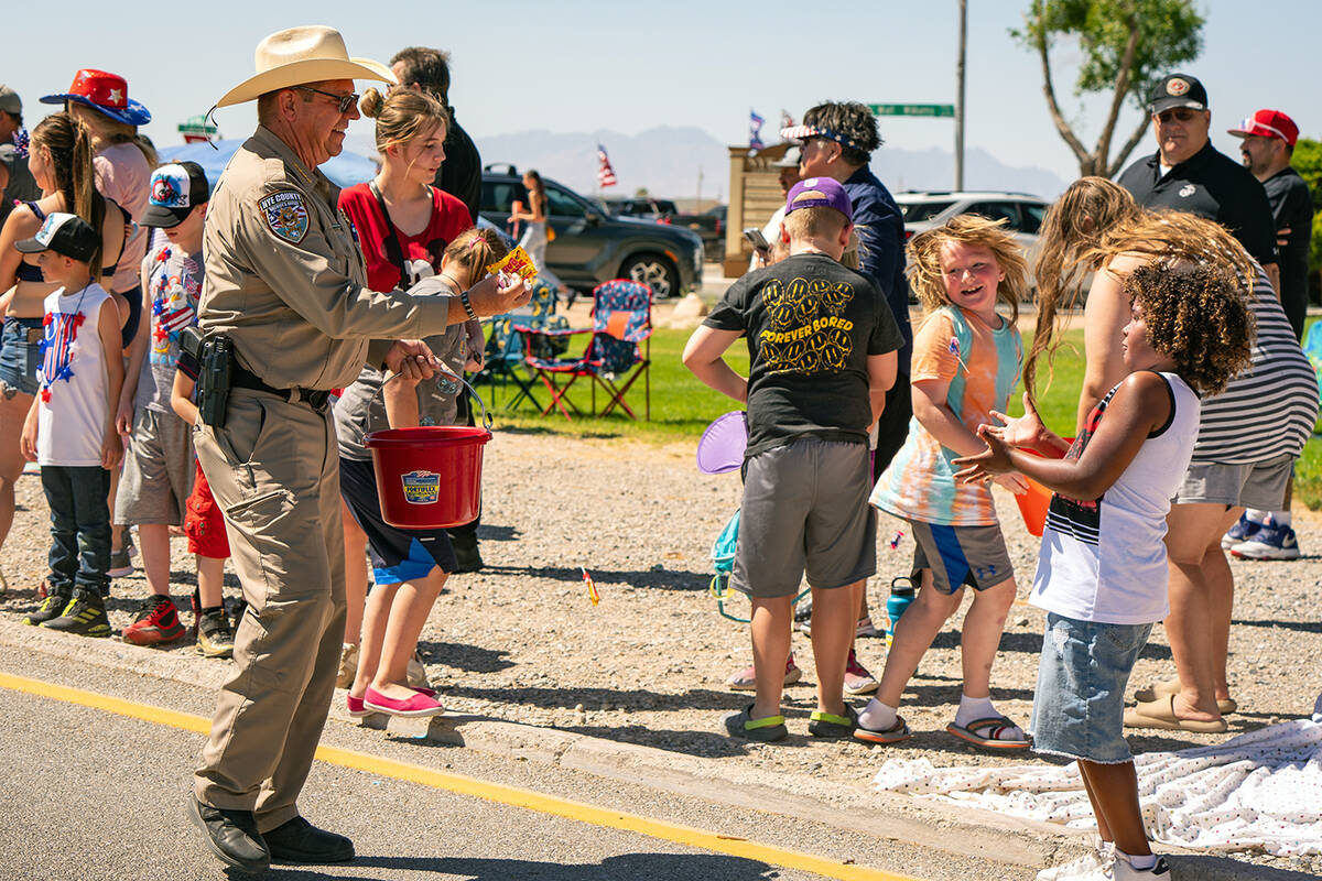 John Clausen/Pahrump Valley Times Nye County Sheriff Joe McGill is pictured handing out goodies ...