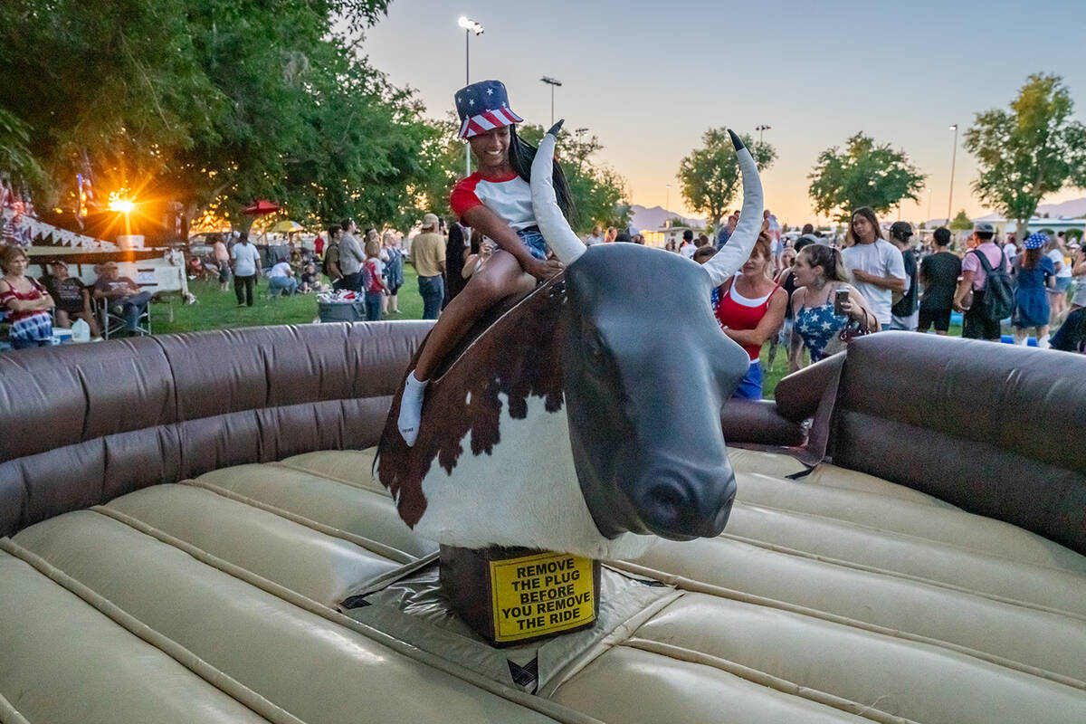 John Clausen/Pahrump Valley Times The mechanical bull saw plenty of action on the 4th of July, ...